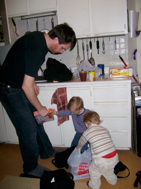 boys helping daddy with groceries