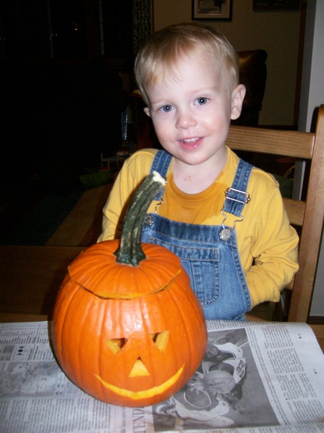 Elijah with happy pumpkin